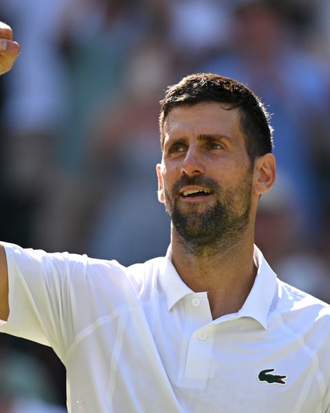 Novak Djokovic celebrates breaking Roger Federer's record for most Wimbledon singles wins in 2026