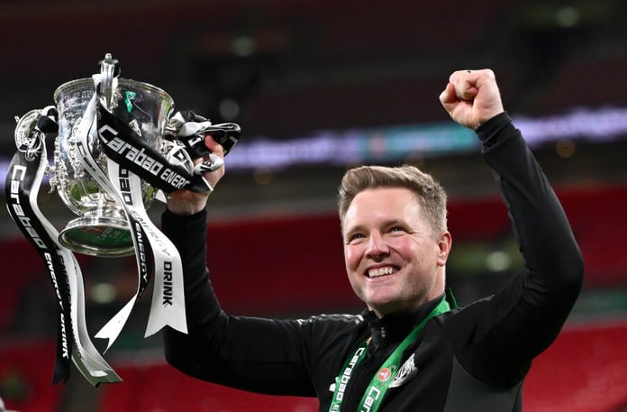 Eddie Howe raises the League Cup trophy after Newcastle United's victory over Liverpool at Wembley in March 2025
