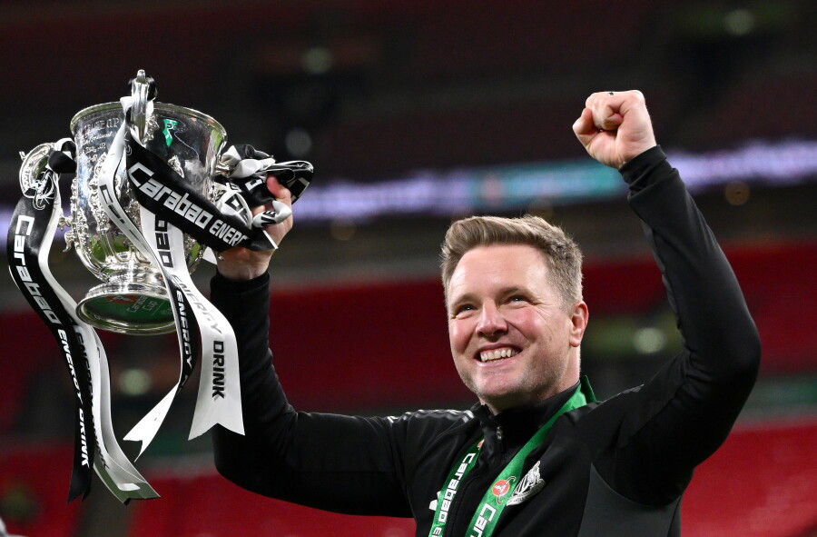 Eddie Howe raises the League Cup trophy after Newcastle United's victory over Liverpool at Wembley in March 2025
