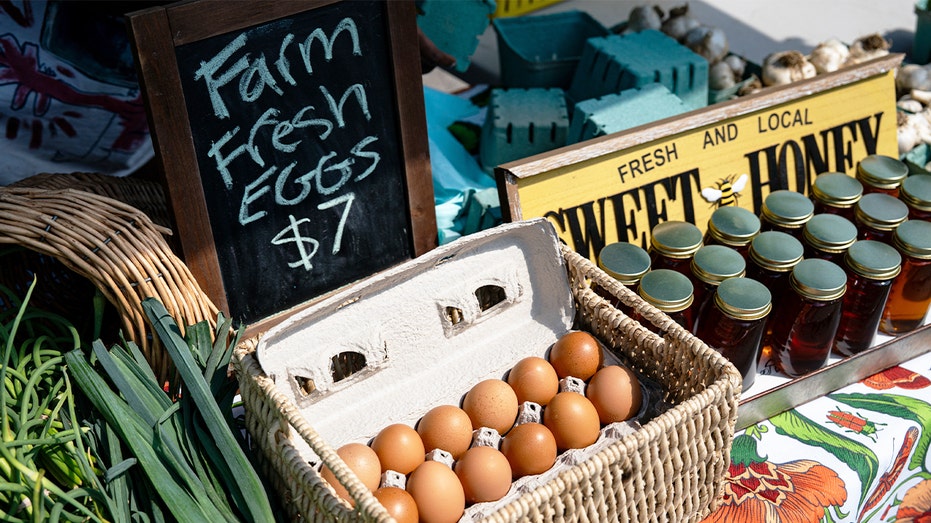 Fresh farm eggs at a farmers market amid DOJ price-fixing settlement with Cal-Maine and egg producers