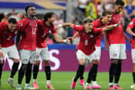 Egypt players celebrate after defeating Australia 4-2 on penalties in the 2026 FIFA World Cup Round of 32 in Arlington Texas