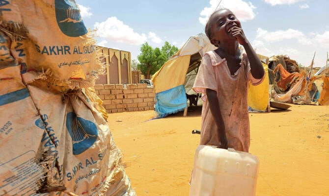 Displaced families wait for food distribution in El-Obeid, North Kordofan, Sudan amid the ongoing civil war