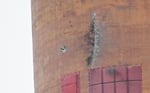 Damage to the Auvere power station chimney in Estonia after a stray Ukrainian drone strike in March 2026