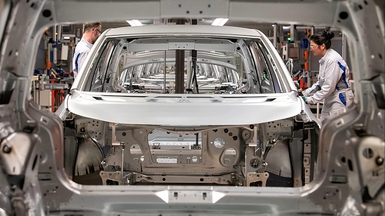 Electric vehicle assembly line at a European auto plant as Tesla Q2 2026 deliveries beat estimates