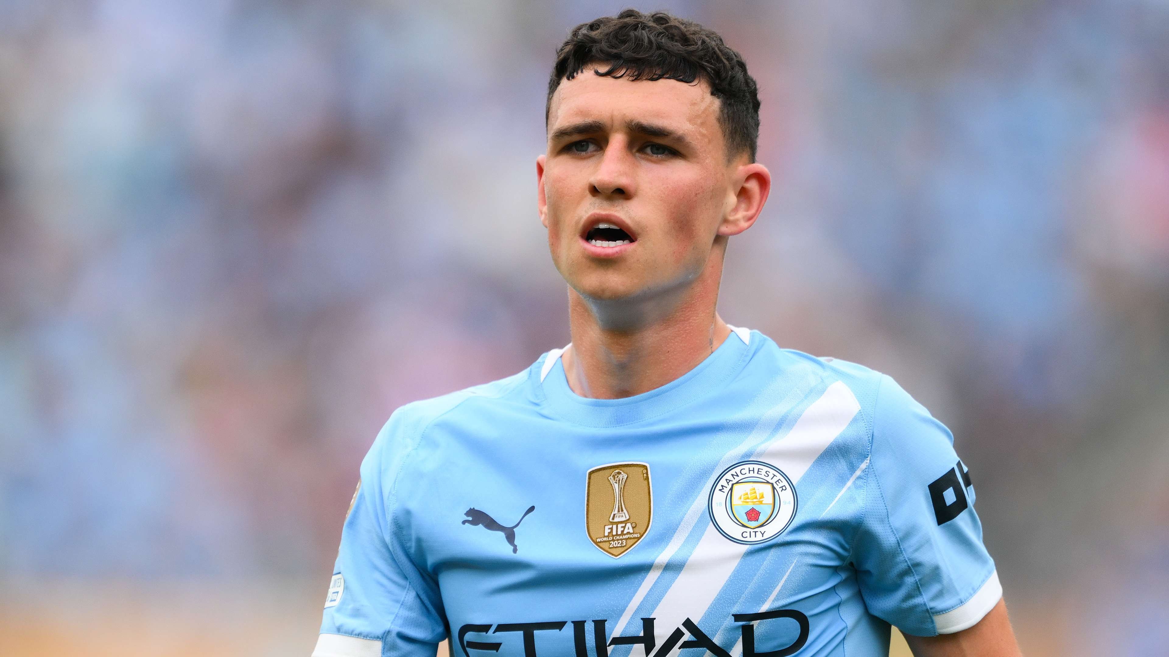 Phil Foden signs his new Manchester City contract extension at the Etihad Stadium in July 2026