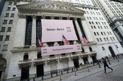 New York Stock Exchange building with Hims and Hers Health banner on facade in Manhattan