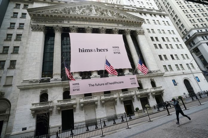 New York Stock Exchange building with Hims and Hers Health banner on facade in Manhattan