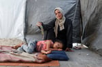 Displaced Palestinians sheltering at a school in Khan Younis as Gaza marks 1000 days of war