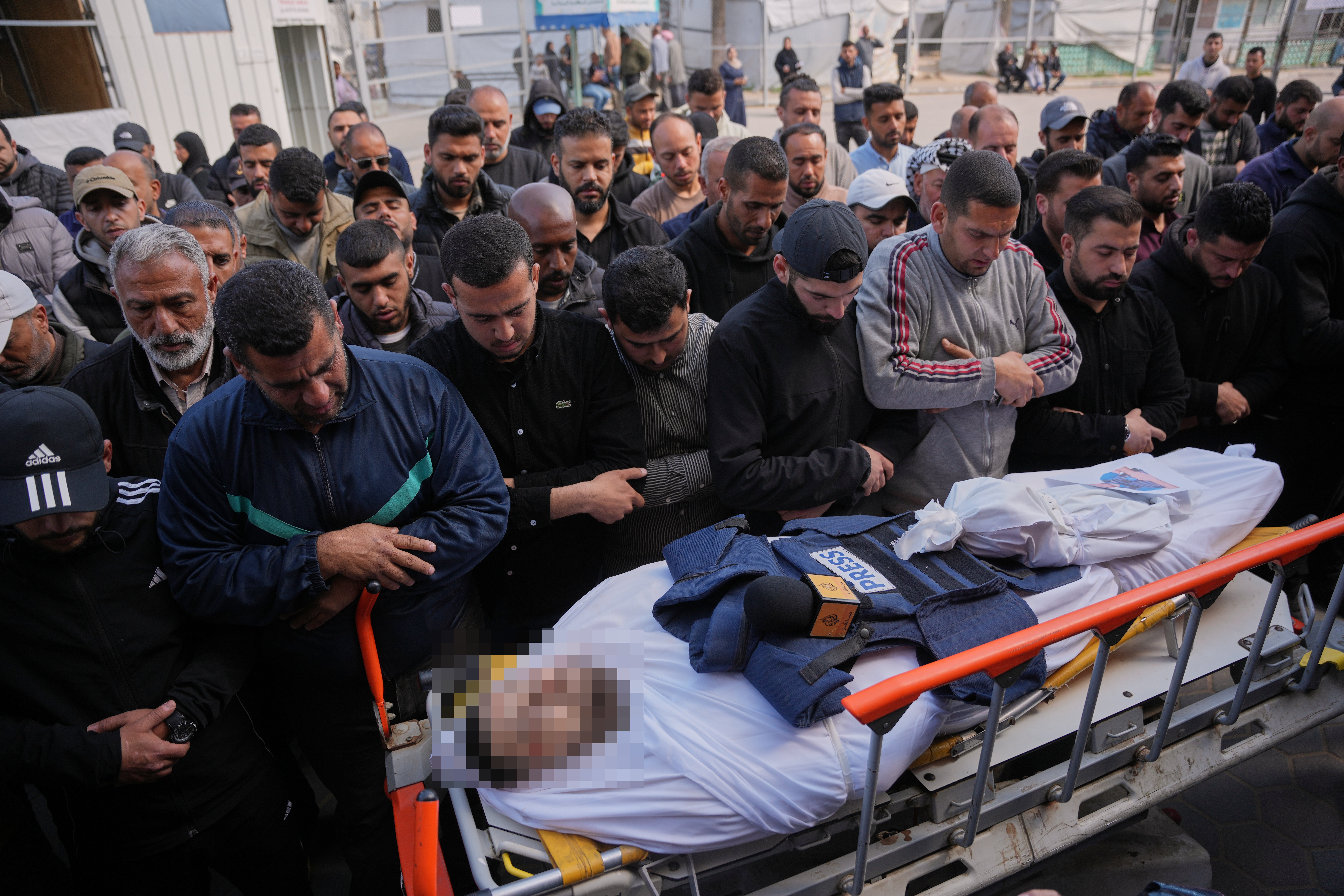 Palestinians gather to mourn during Israel's military operations in Gaza, April 2026, six months into the ceasefire