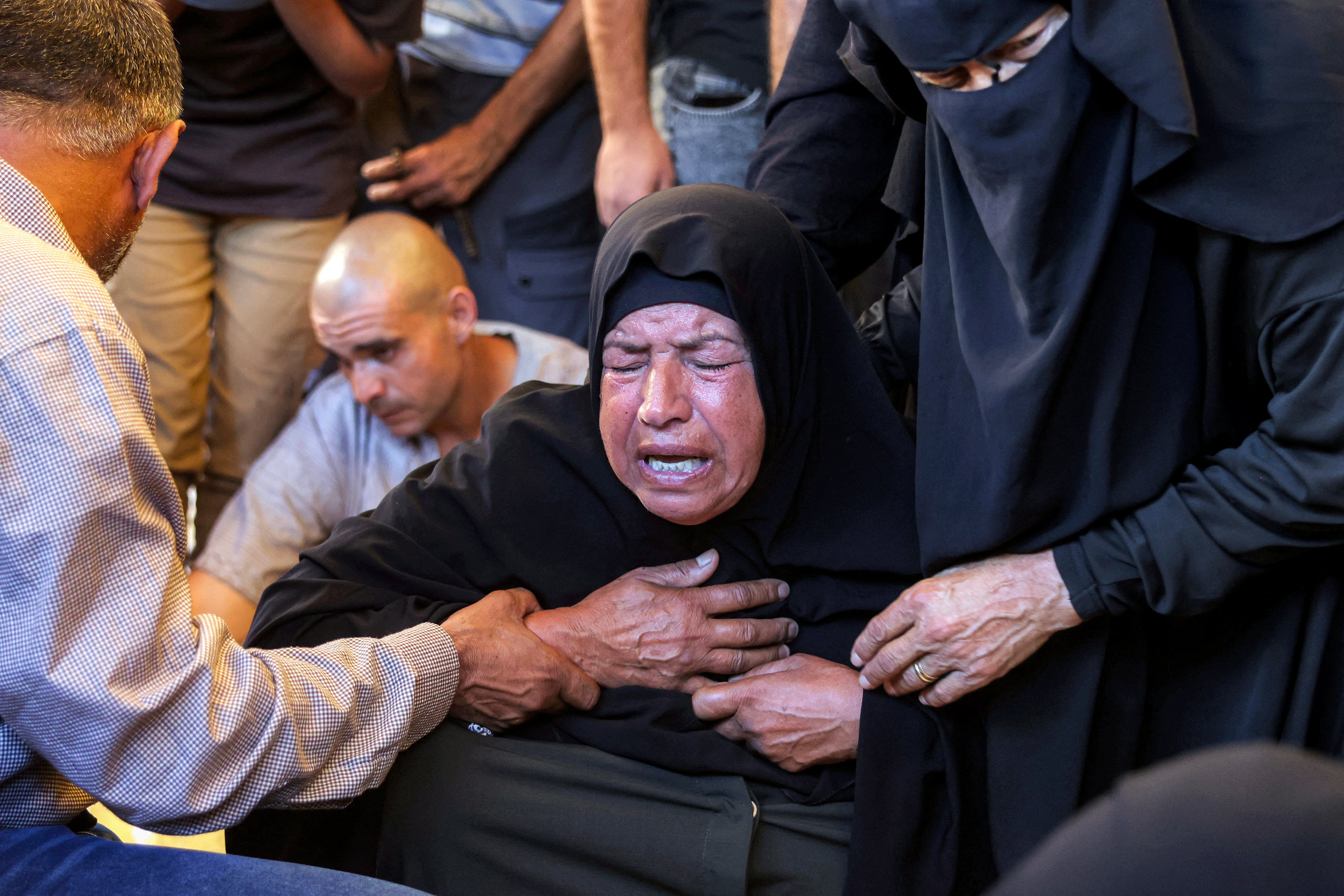 A Palestinian mourner at the funeral of a victim killed in an Israeli strike in Gaza, July 2026