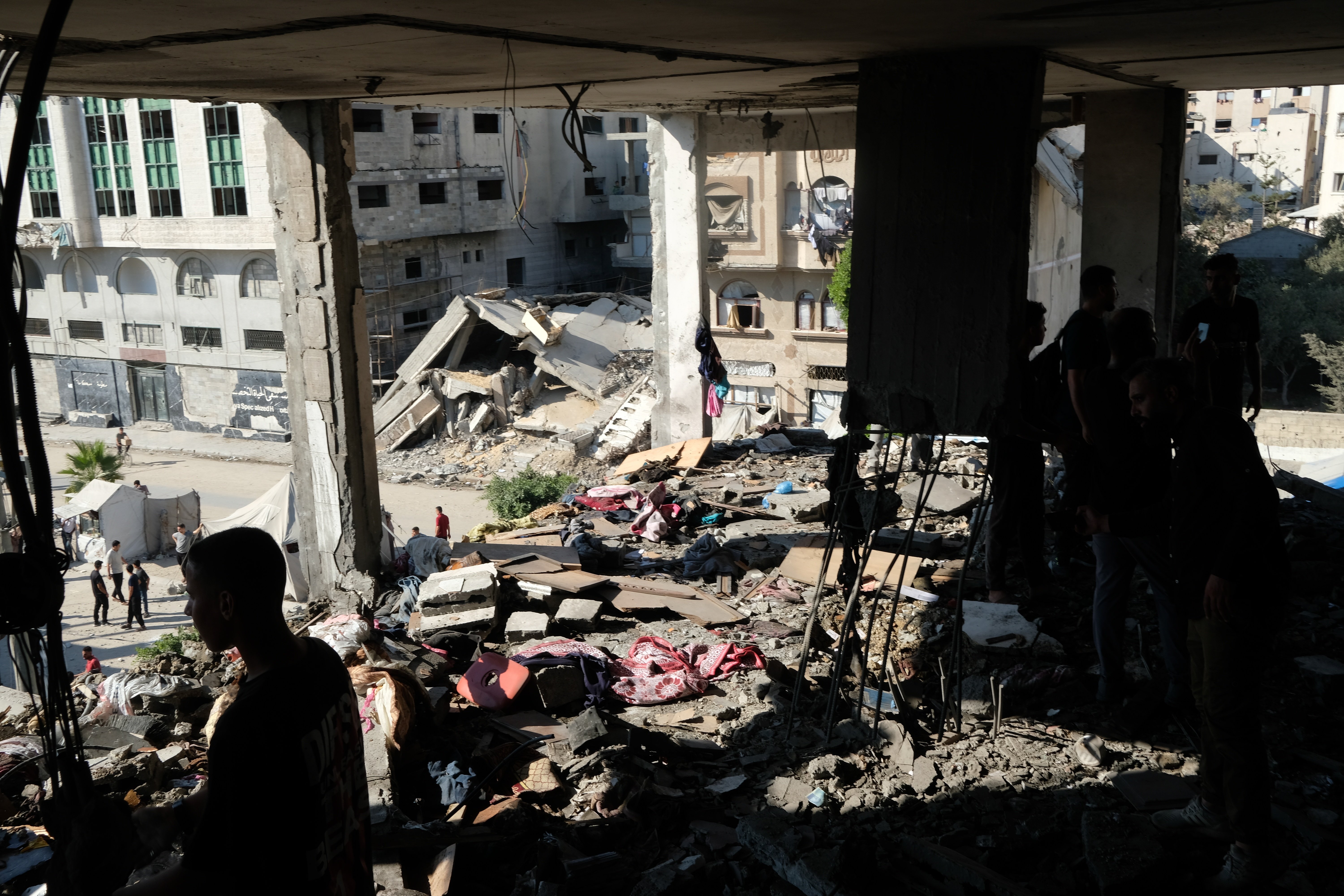 Destruction in Gaza from Israeli strikes on residential areas as settlement plans announced