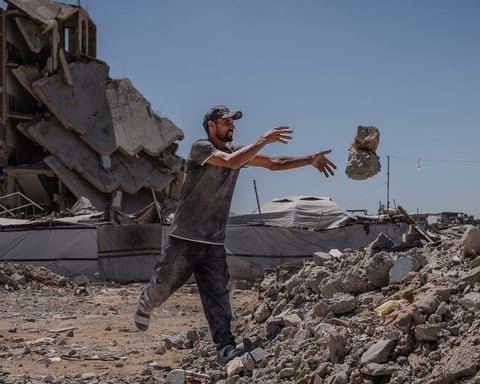 Man clearing rubble in Jabalia camp in northern Gaza, amid destruction from Israeli military operations in June 2026