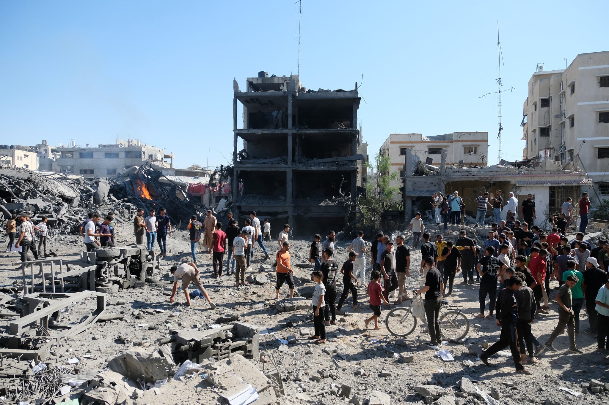 Palestinians gather at the site of an Israeli strike in Gaza City's Sabra neighborhood July 2026