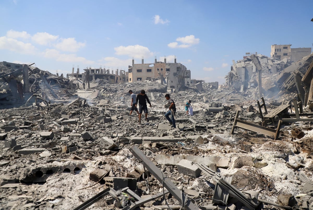 Palestinians inspect site of Israeli strike on storage facility Gaza City July 27 2026