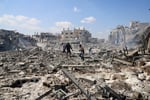 Palestinians inspect site of Israeli strike on storage facility Gaza City July 27 2026
