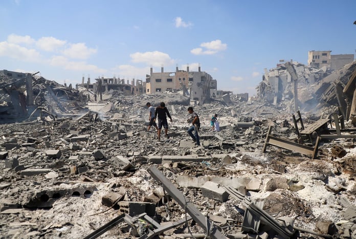 Palestinians inspect site of Israeli strike on storage facility Gaza City July 27 2026