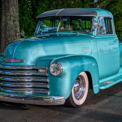 Chevrolet truck on the road representing General Motors North American vehicle sales