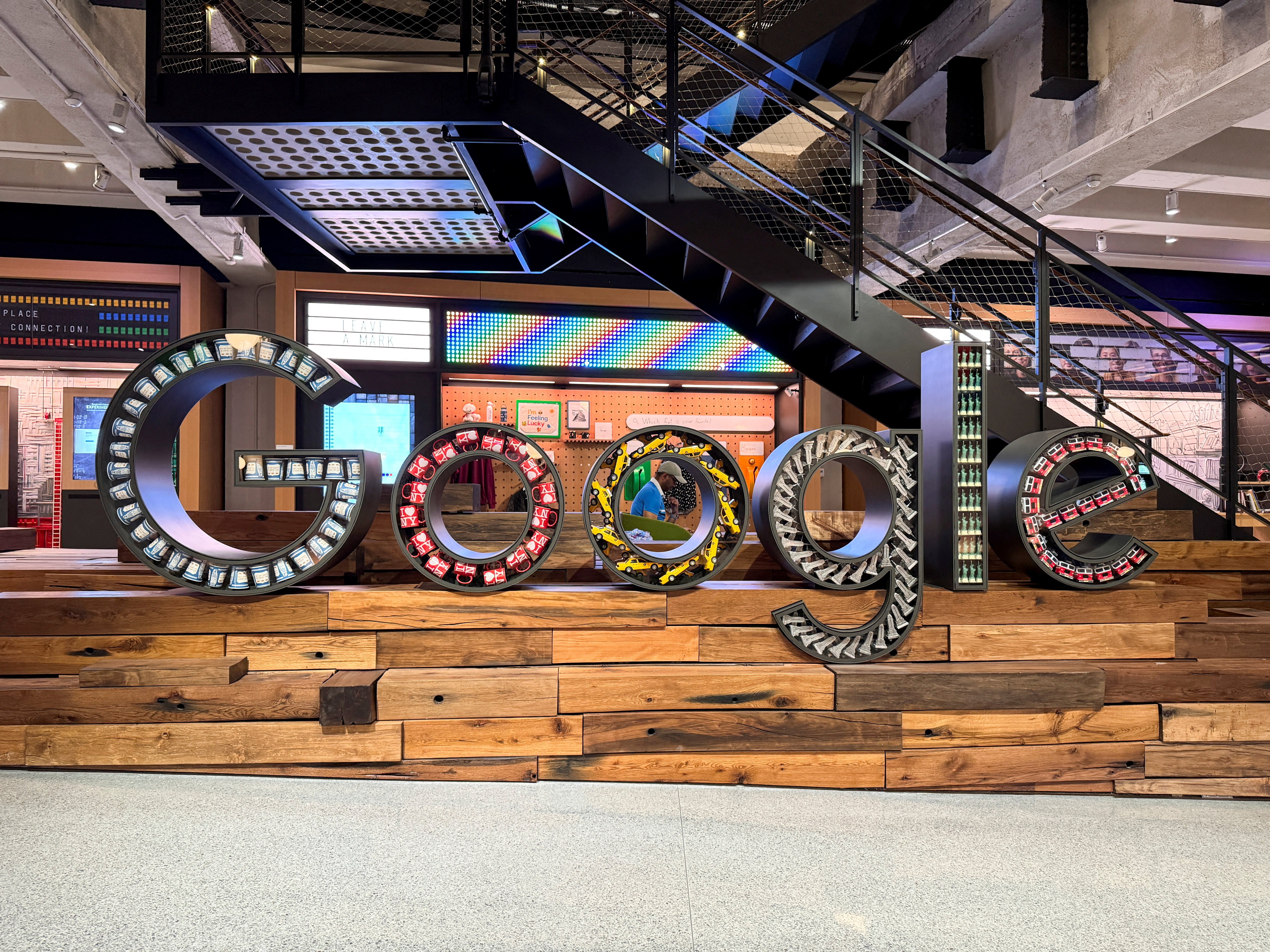 Google headquarters sign with EU flag overlay representing Digital Markets Act fine