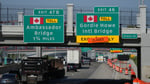 Highway signs marking the Gordie Howe International Bridge connecting Windsor and Detroit