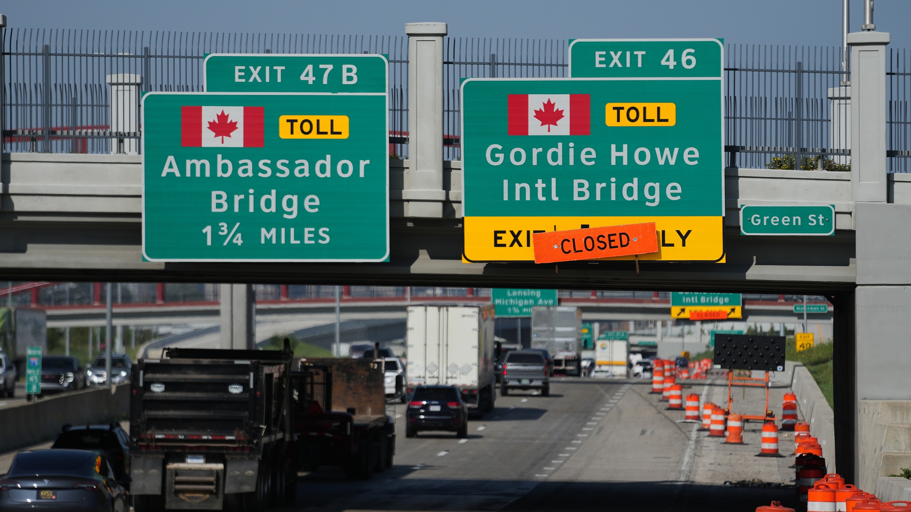 Highway signs marking the Gordie Howe International Bridge connecting Windsor and Detroit