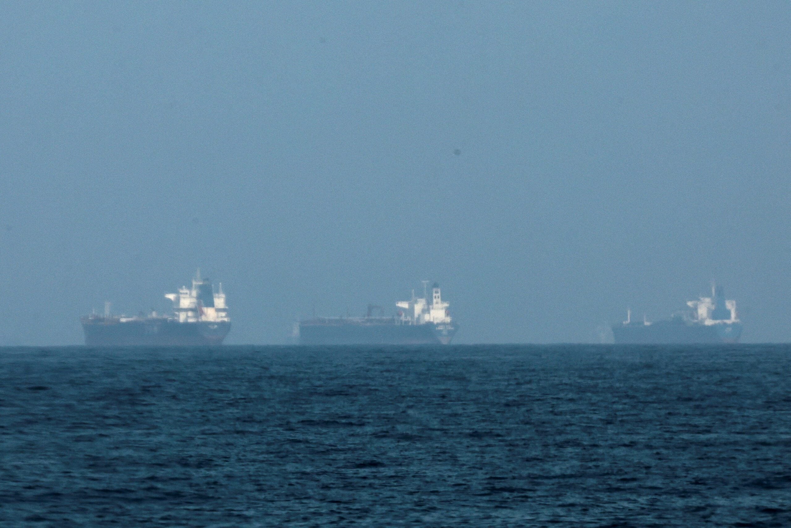 Tankers anchored near Fujairah waiting to transit the Strait of Hormuz as central lanes remain mined