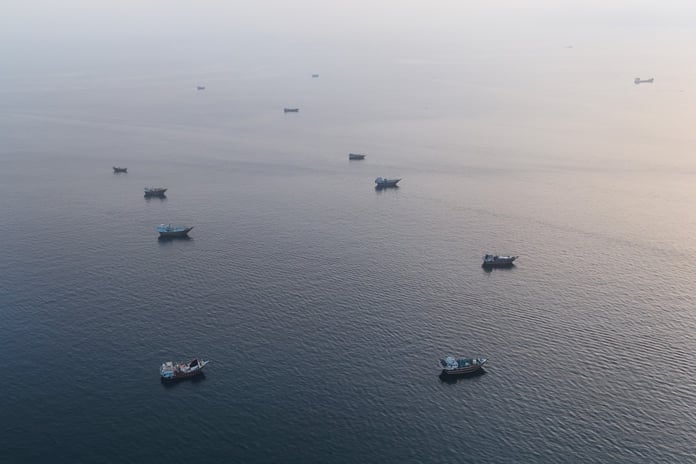 Vessels anchored near Oman's Musandam Peninsula at the Strait of Hormuz during the June 2026 Iran-US escalation
