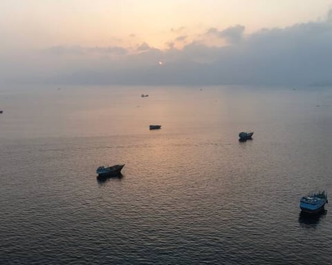 Strait of Hormuz shipping lane with tankers, UNCTAD economic fallout report July 2026