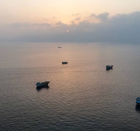 Strait of Hormuz shipping lane with tankers, UNCTAD economic fallout report July 2026