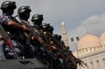 Members of Houthi security force stand guard at rally in Sanaa Yemen July 2026 as Houthis declared naval blockade against Saudi Arabia