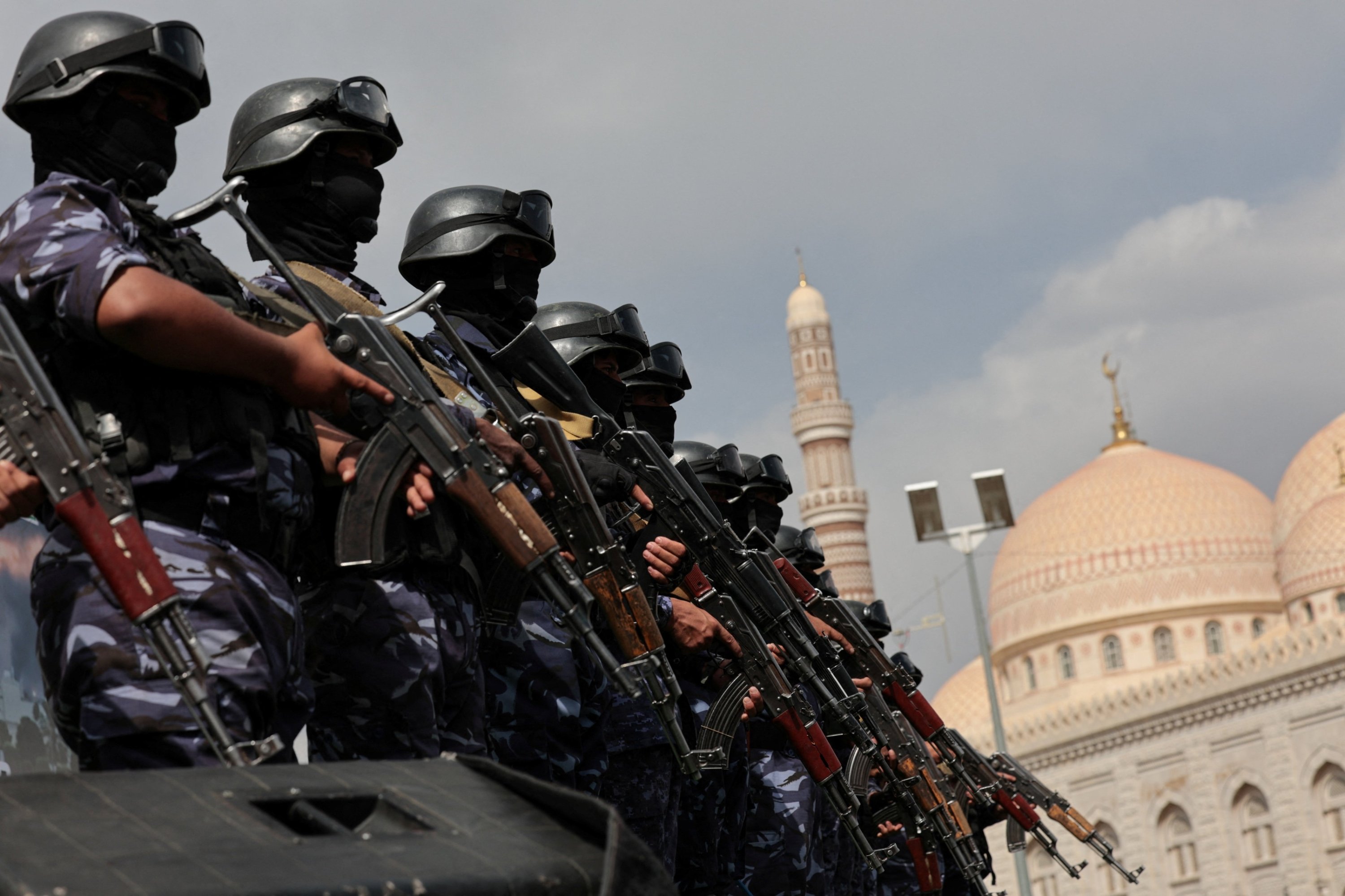Members of Houthi security force stand guard at rally in Sanaa Yemen July 2026 as Houthis declared naval blockade against Saudi Arabia
