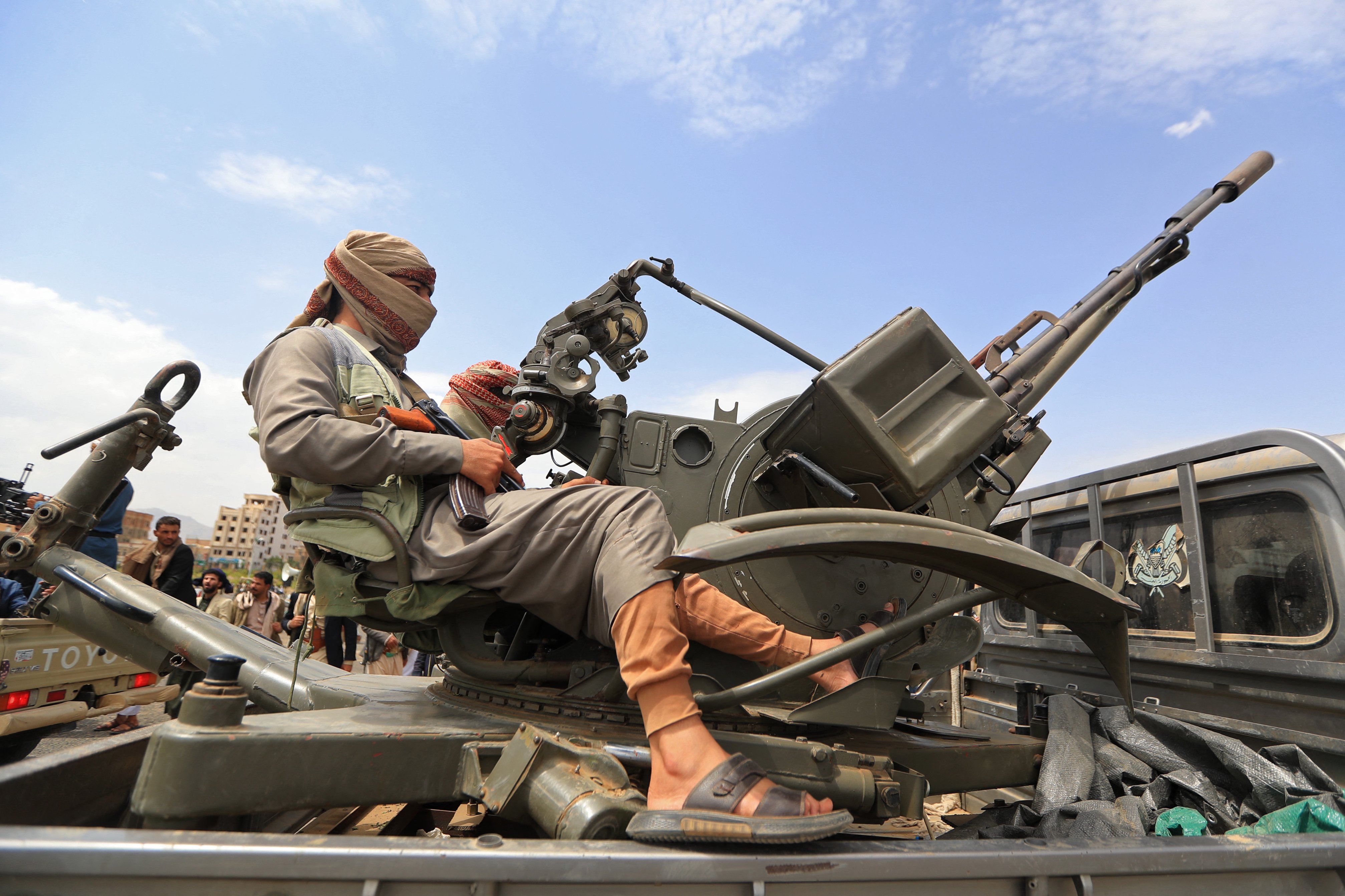 A Houthi fighter at a rally in Sanaa, Yemen, after the group threatened Saudi Arabia following the Abha airport missile attack in July 2026
