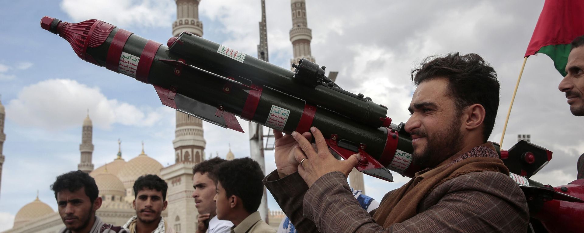 Houthi supporters march at Jerusalem Day rally in Sanaa Yemen waving Palestinian flags
