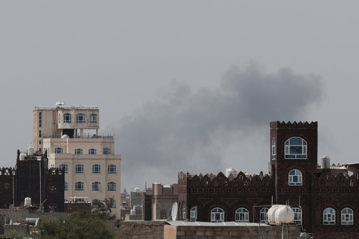 Smoke and damage at Sanaa International Airport after the Yemeni government struck the runway on July 13, 2026, triggering Houthi retaliatory missile and drone strikes against Saudi Arabia's Abha airport