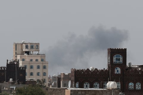 Smoke and damage at Sanaa International Airport after the Yemeni government struck the runway on July 13, 2026, triggering Houthi retaliatory missile and drone strikes against Saudi Arabia's Abha airport