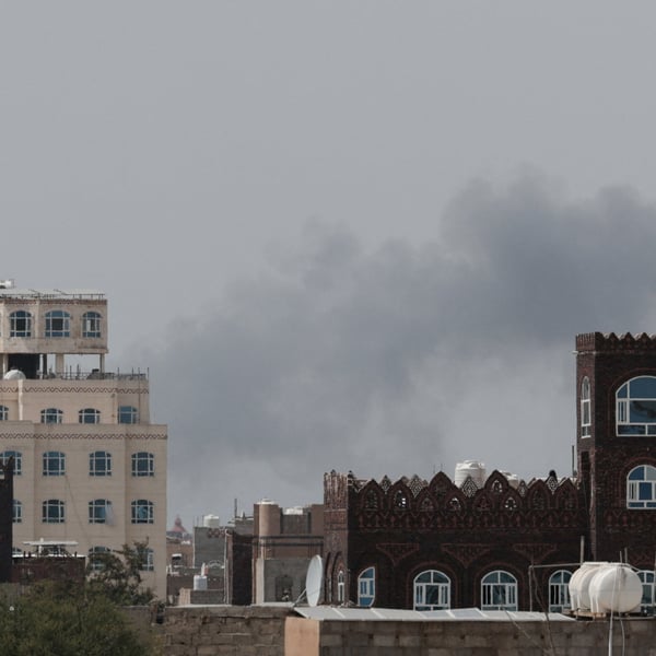 Smoke and damage at Sanaa International Airport after the Yemeni government struck the runway on July 13, 2026, triggering Houthi retaliatory missile and drone strikes against Saudi Arabia's Abha airport