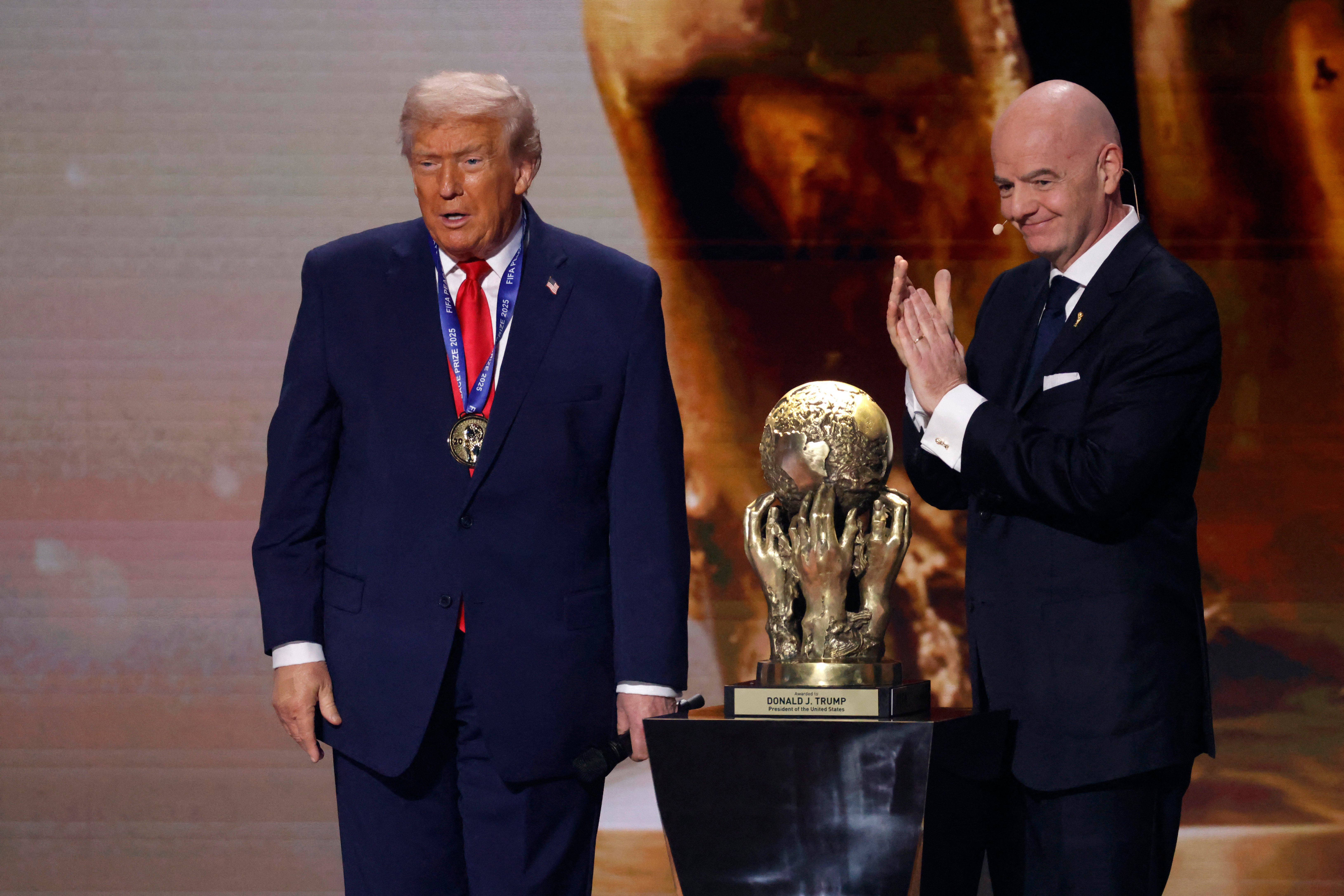 FIFA President Gianni Infantino presents Donald Trump with the FIFA Peace Prize at the Kennedy Center draw ceremony