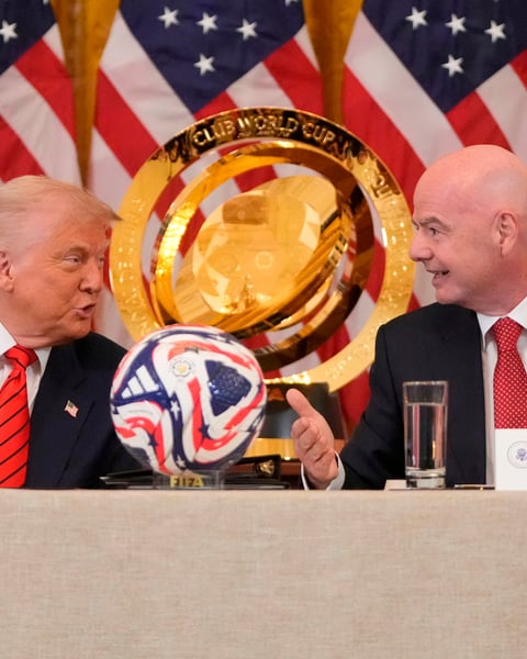 FIFA President Gianni Infantino stands with Donald Trump at the White House