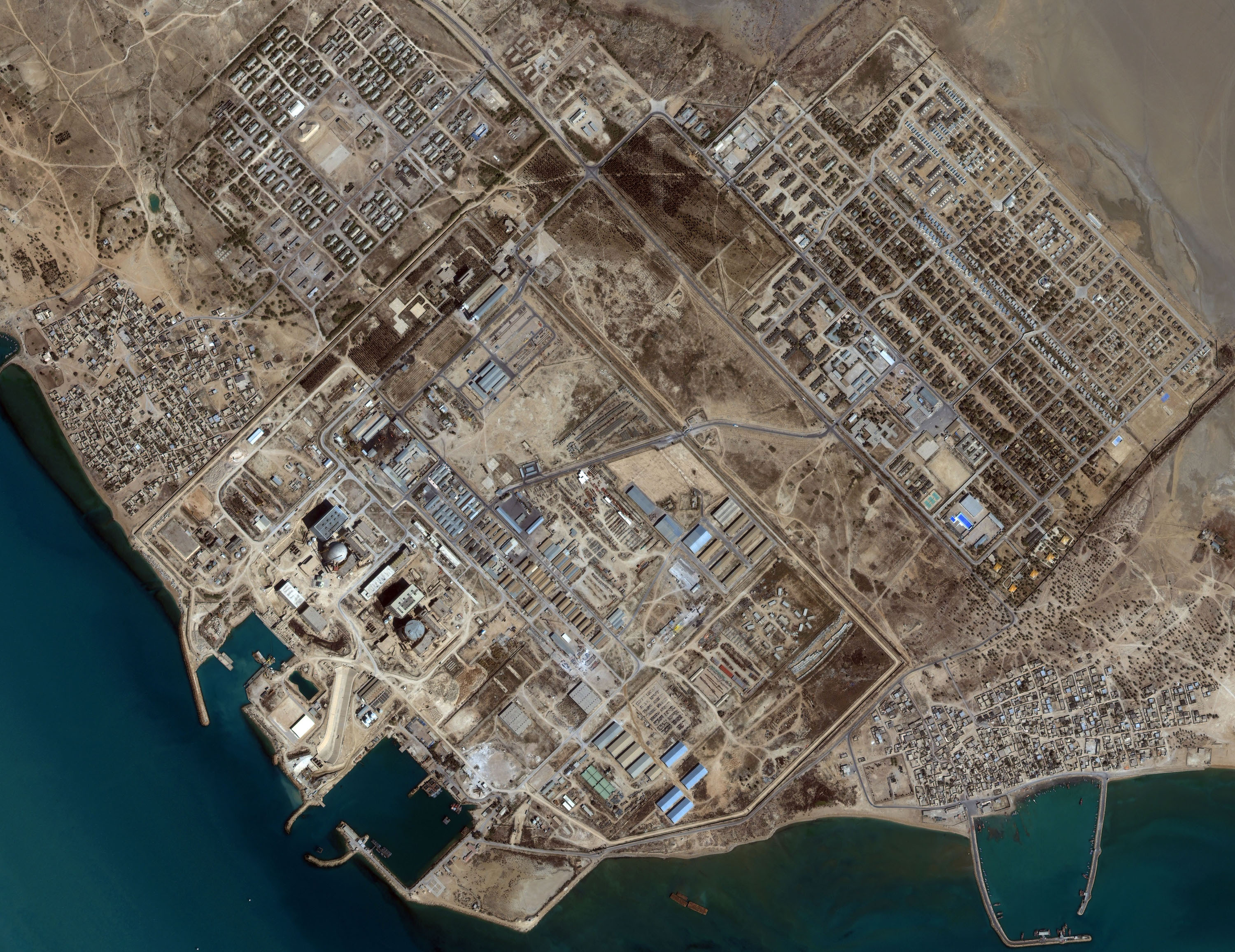 Aerial satellite view of Iran's Bushehr nuclear power plant complex showing the reactor and surrounding facilities