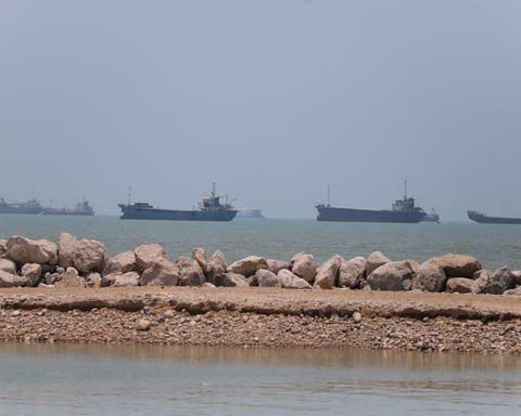 Vessels navigating near Bandar Abbas in the Strait of Hormuz as Iran claims command authority over the strategic waterway