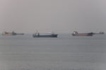 Commercial vessels transiting the Strait of Hormuz near Bandar Abbas, Iran, as US-Iran talks unfold in Doha