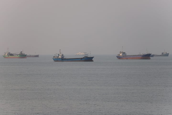 Commercial vessels transiting the Strait of Hormuz near Bandar Abbas, Iran, as US-Iran talks unfold in Doha