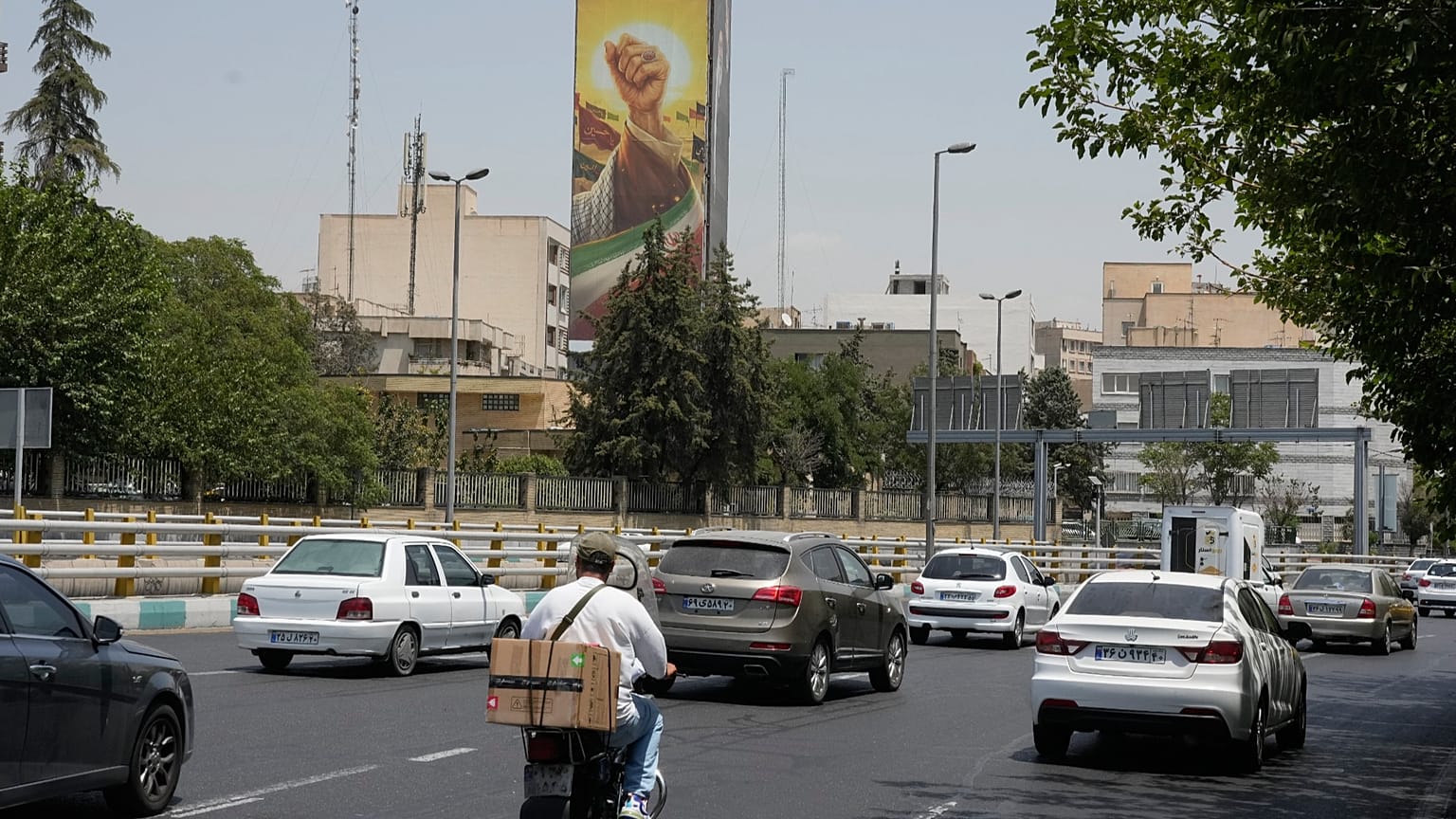 Billboard depicting Khamenei fist in Tehran as Trump pushes Iran ceasefire deal