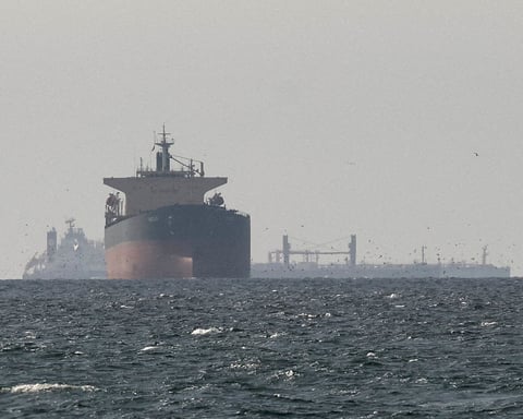 An oil tanker transits the Strait of Hormuz, through which Iran's crude exports surged under the MoU sanctions waiver