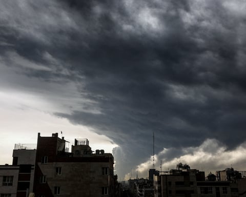 Plumes of smoke rise from bombed oil storage facilities over Tehran, Iran, March 8 2026
