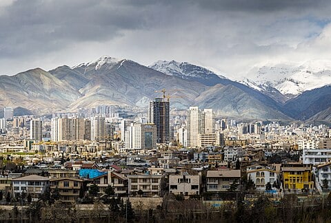 Tehran skyline with snow-capped Alborz mountains in background on a clear day