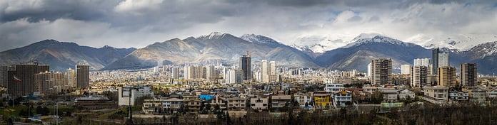 Tehran skyline with snow-capped Alborz mountains in background on a clear day