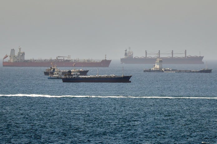 Rescue boats approach burning oil tankers in the Strait of Hormuz as the US carried out its tenth night of strikes on Iran