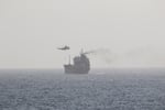 Iranian naval forces boarding a tanker vessel in the Gulf of Oman near the Strait of Hormuz