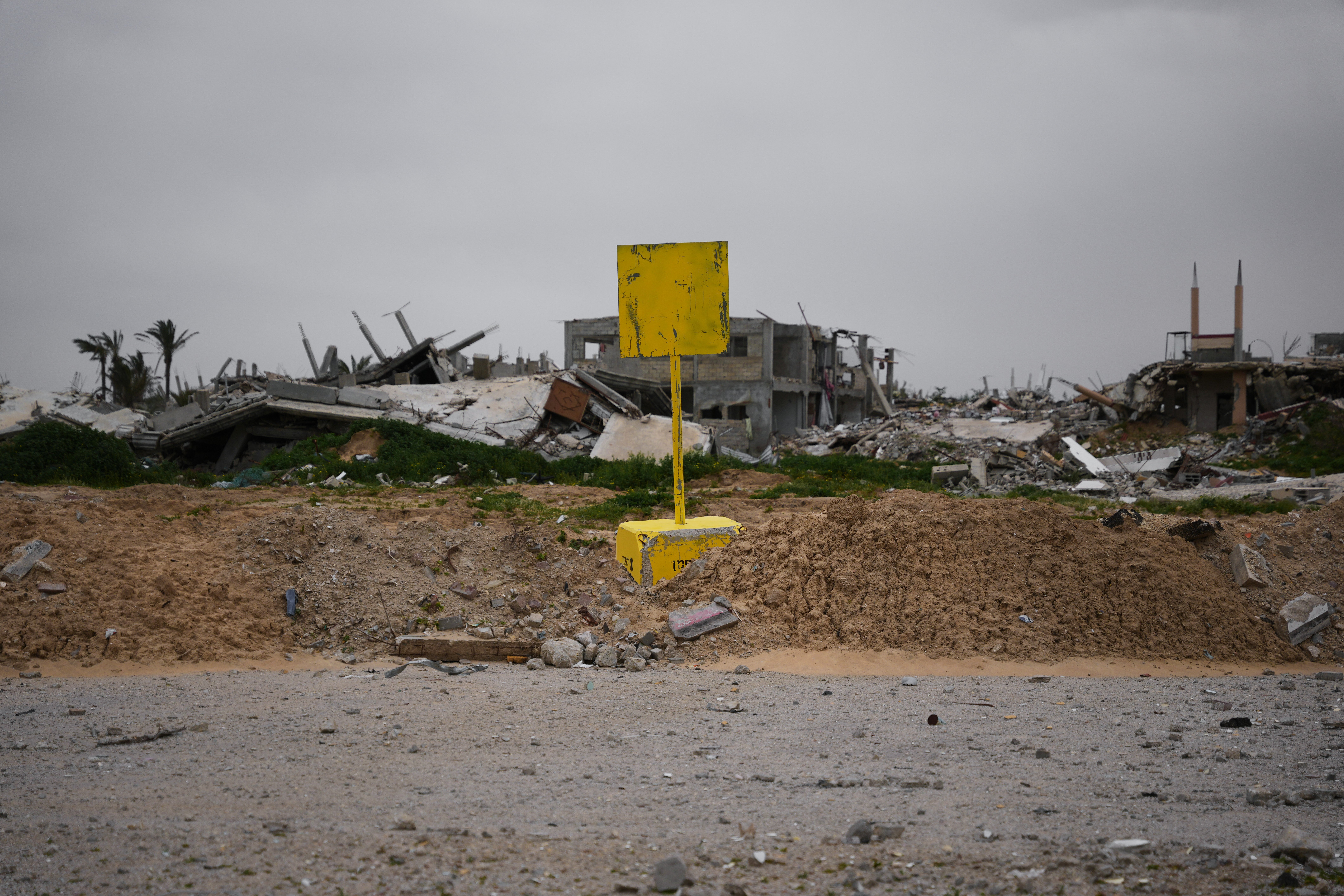 Yellow concrete block marking Israel's military control Yellow Line in Khan Younis Gaza separating Israeli-controlled zones from Palestinian areas