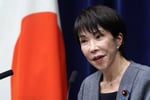 Japan's Prime Minister Sanae Takaichi speaking at a press conference after the passage of Japan's Hinomaru flag desecration law